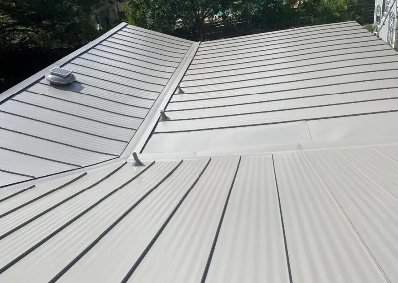Solar attic fan installed on a metal roof for Roof Ventilation in Dover
